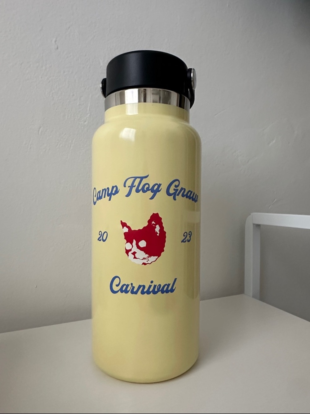 Golf Wang Yellow Insulated Water Bottle with Red Graphic and Blue Text